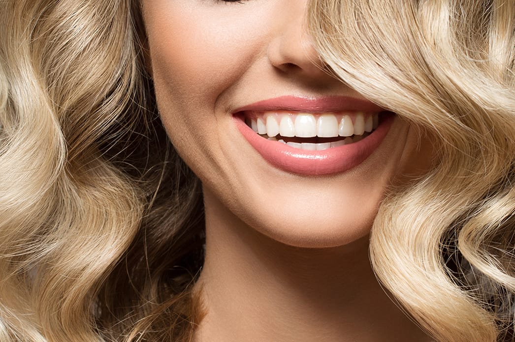 Beautiful cosmetic dentistry results showing perfect white teeth and glossy smile