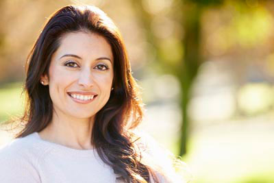 woman smiling after getting sinus augmentation at Boulder Smile Design