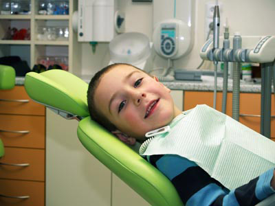 child getting his teeth cleaned at the dentist